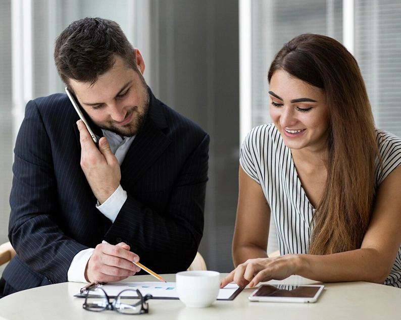 Man and woman discussing plans during a session at Abroad Study Consultancy Kerala